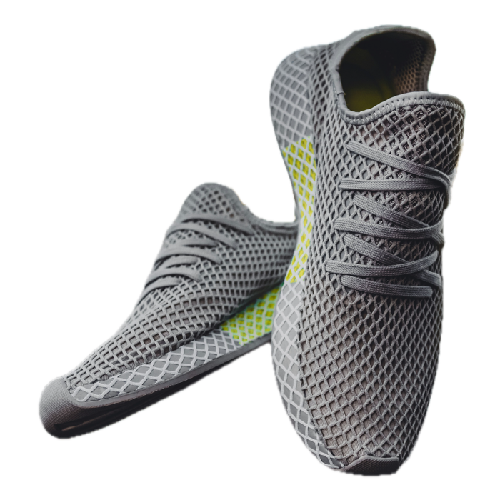 A pair of grey mesh sneakers on a transparent background, exported with Sweepcut's Shopify preset at 2048 by 2048